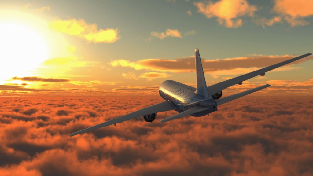 Avião voando em cima das nuvens.